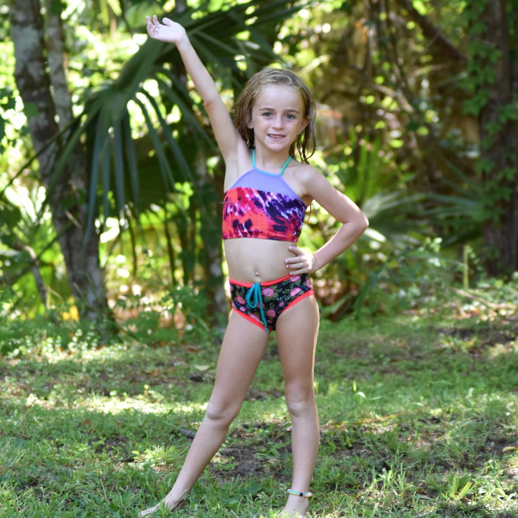 Girls swim top with mesh detail, customizabel and reversible top made with eco-friendly material.