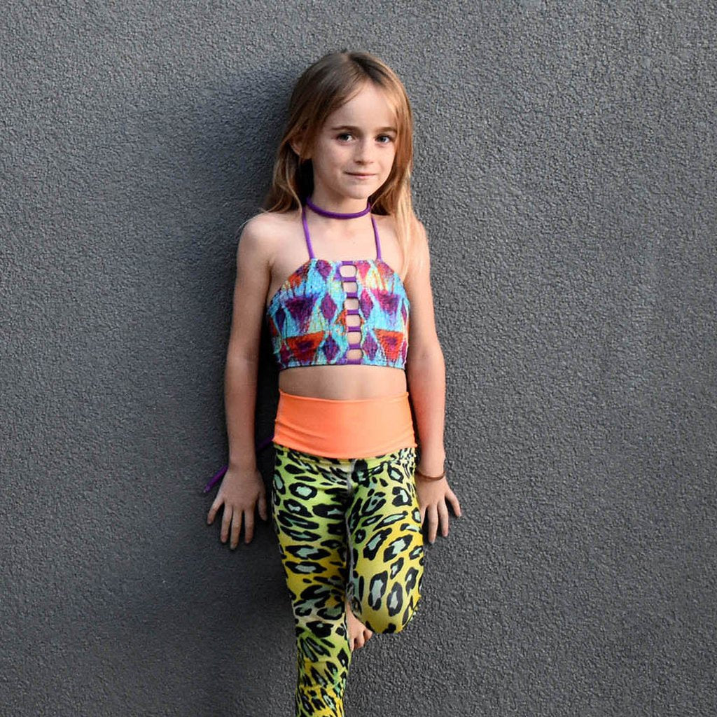 Reversible and customizable girls swim top made with eco-friendly material.