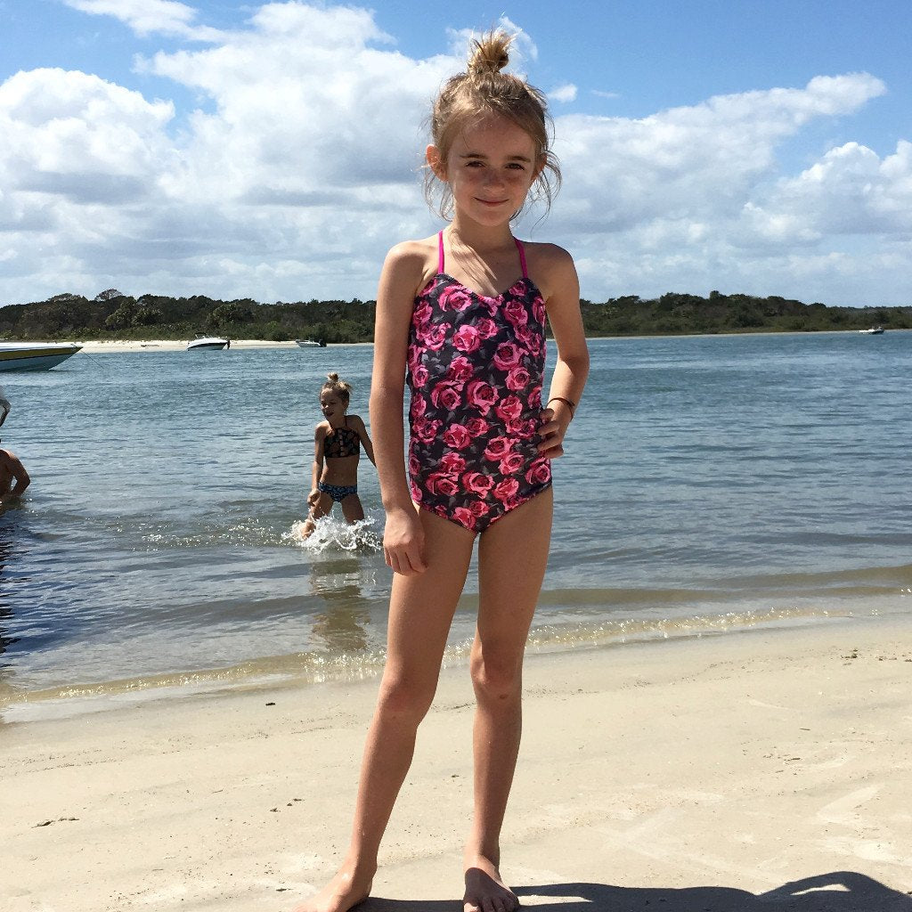Customizable and reversible one-piece swimsuit for girls, made with eco-friendly material.