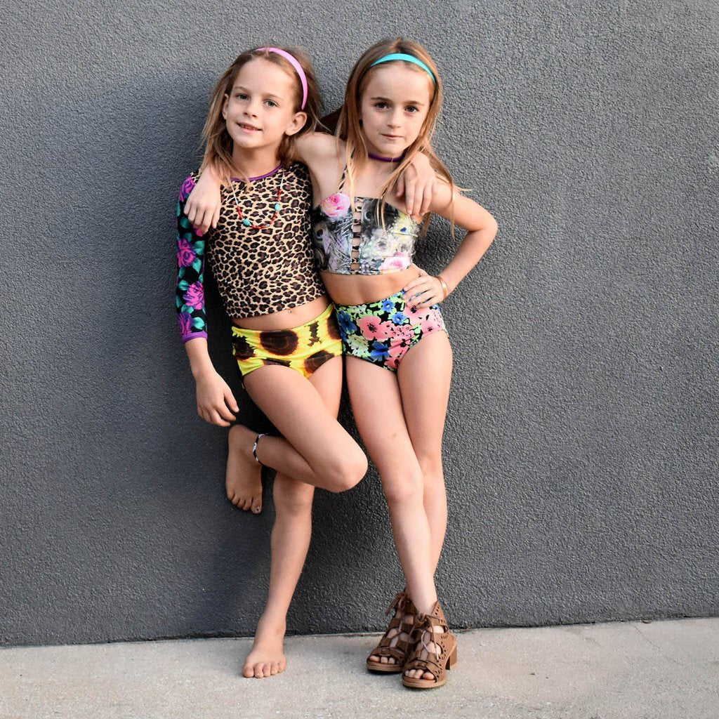 Girls high-wasited, customizable, and reversible swim bottoms made with eco-friendly material.